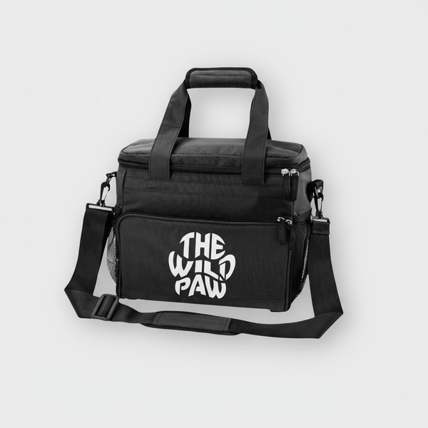 Black bag for pet's supplies with 'The Wild Paw' logo on a light gray background