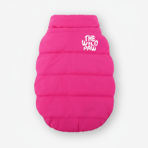 Pink dog puffer jacket with 'The Wild Paw' logo on a white background