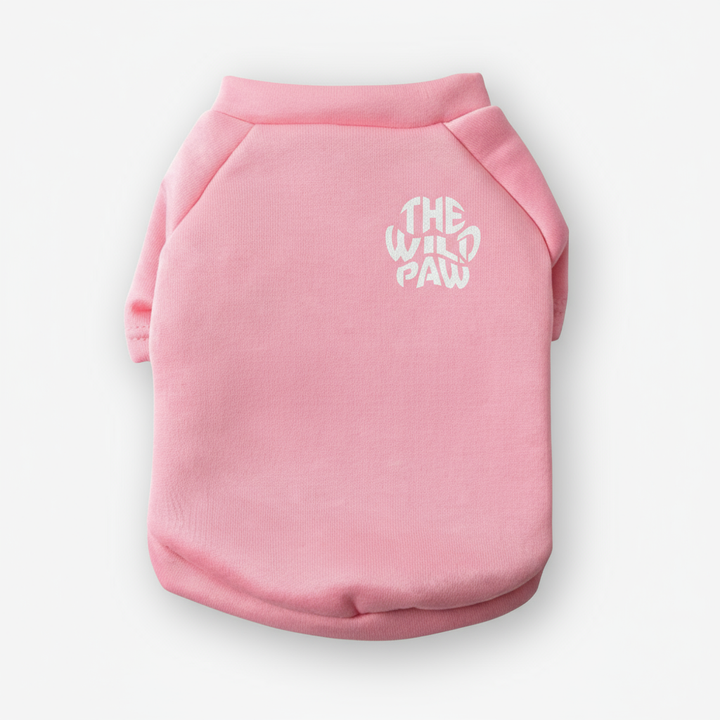 Pink dog sweater with 'The Wild Paw' logo on a white background