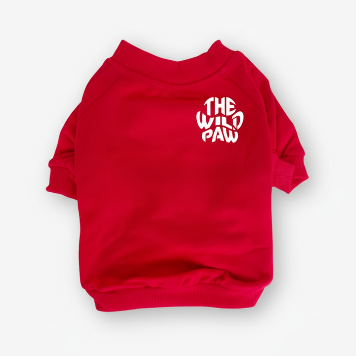Red pet sweater with 'The Wild Paw' text on a white background